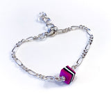 Rosa fargerikt armbånd til barn. Design inspirert av godteri. Selges i sett med smykke, perfekt dåpsgave