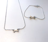 Sløyfe - smykke og armbånd i sølv