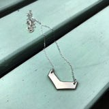 Håndlaget sølvsmykke. Design: Visekorporal